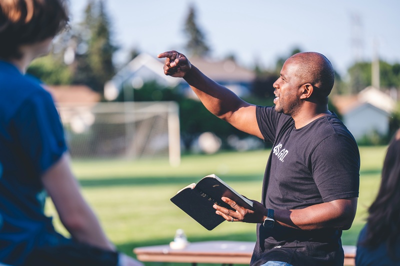 Man sharing a Bible devotion