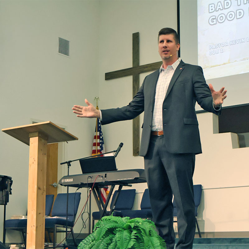 Pastor Kevin Long preaching at Trinity Baptist Church