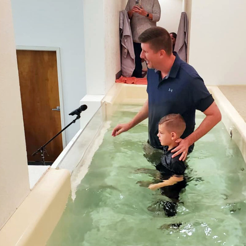 Pastor Kevin Baptizing a young kid