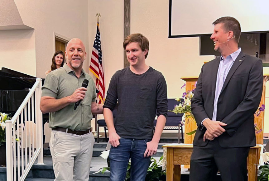 Rob and Pastor Kevin with youth about to get baptized