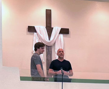 Mr. B baptizing one of the youth