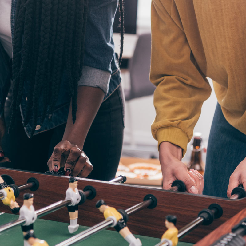 Youth group game time playing foosball together at Trinity Baptist Church in Lakeland