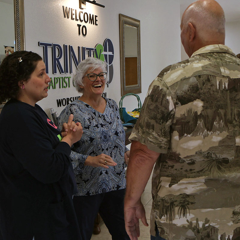 Vicki greeting visitors in foyer at Trinity Baptist Church in Lakeland FLorida