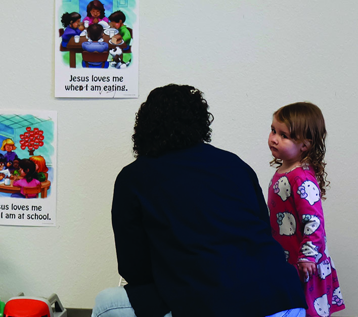 adult assisting a child