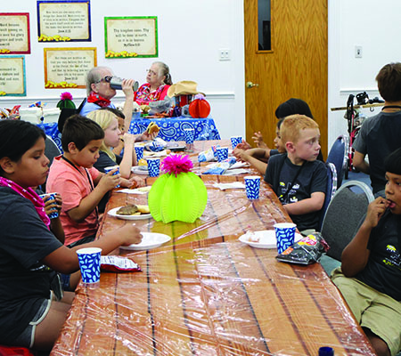 Kids having dinner while at Trinity Baptist Church's VBS in Lakeland, FL.