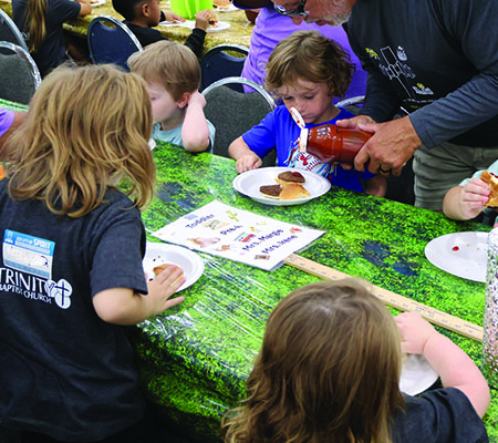 Kids having dinner at Trinity Baptist Church's VBS in Lakeland, FL.