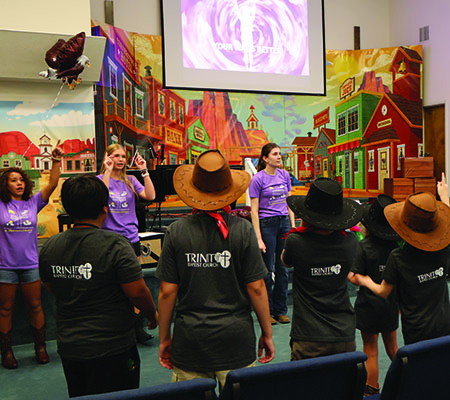 Older kids worshiping while at Trinity Baptist Church's VBS in Lakeland, FL.