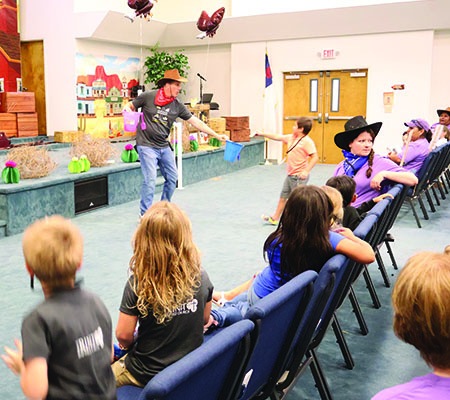 Kids tithing while at Trinity Baptist Church's VBS in Lakeland, FL.