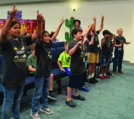 Kids worshipping while at Trinity Baptist Church's VBS in Lakeland, FL.