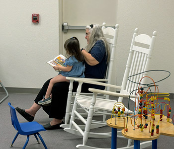 TBC nursery worker reading a book to a toddler at Trinity Baptist Church. Baptist church Lakeland, FL. Trinity Baptist Church. Baptist church Lakeland Florida. Baptist church Lakeland, fl. Lakeland Florida Baptist church. Baptist Lakeland. Lakeland Baptist church. Churches in lakeland, florida. Churches in lakeland fl. Family worship lakeland florida. Southern Baptist church. Southern Baptist convention. Florida southern baptist. Southern Baptist convention Florida.